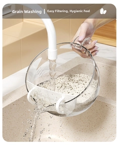 Close-up of transparent kitchen colander bowl with ergonomic handle and precise scale