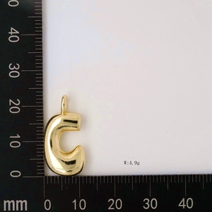 Detailed view of puff letter C pendant measuring 23mm by 16mm with 4.9g weight