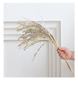 Close-up of sparkling DIY firework sequins branches in gold, silver and rose gold colors