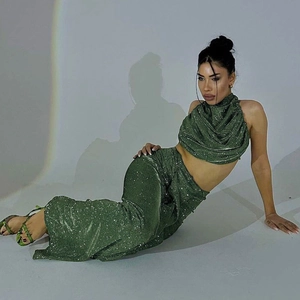 Sparkly green two-piece set featuring a halter crop top and high waist long skirt for women