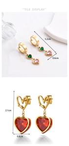 Detail display of gold heart earrings with dimensions and sparkling gemstones