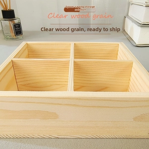 Macro detail of a four-compartment pine wood organizer showing natural wood grain textures