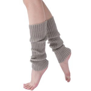 Close-up of taupe knit leg warmers showing the textured fabric and slouchy fit on a model