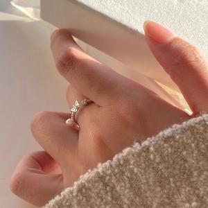 Detailed view of an S925 silver open ring featuring a delicate pearl and butterfly motif