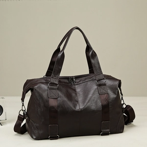 Large dark brown PU leather travel duffel bag with handles and adjustable shoulder strap