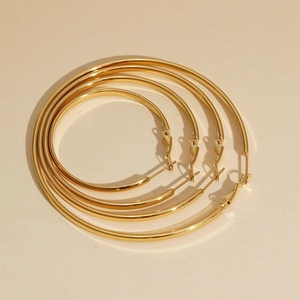 Set of four sizes minimalist golden stainless steel hoop earrings for women