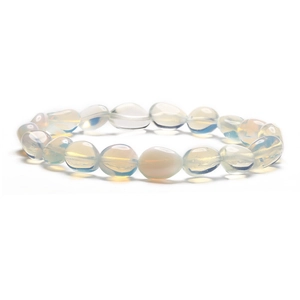 Macro shot of irregular milky white opal stone beads on a minimalist stretch bracelet