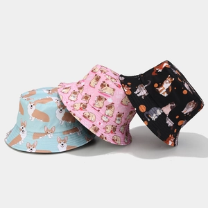 Reversible cartoon animal bucket hat in light blue pink and black with pet prints