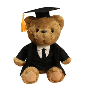 Plush brown graduation teddy bear in black academic cap and gown for a commemorative gift
