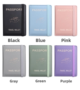 Flat lay of multiple PU leather passport wallets in six colors with elastic bands