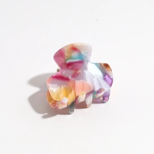 Detail of colorful gradient marble hair claw clip with glossy resin finish