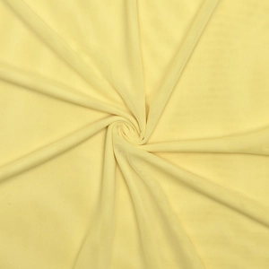 Detailed macro view of yellow mesh fabric texture and draped fold design on the dress