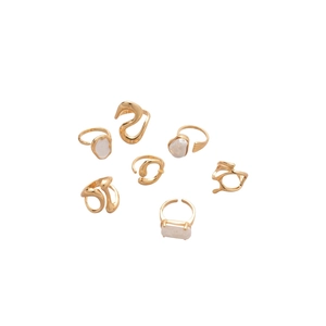 Set of minimalist adjustable gold open rings featuring baroque pearls and lava texture