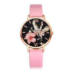 Detail of pink floral dial watch with rose gold case and matching leather strap