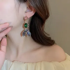 Vintage mermaid tail drop earrings with pink and green gems and sparkling sequins