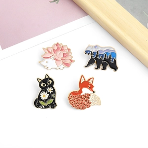 Set of 4 cute enamel animal brooches featuring a hedgehog, bear, cat, and fox designs