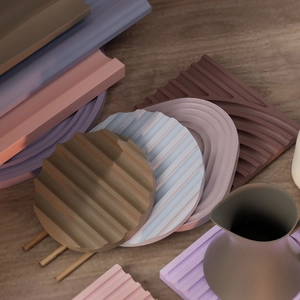 Macro view of grooved silicone tray molds in wave patterns and Morandi colors