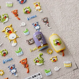Detailed macro view of 3D embossed cat nail stickers with cute kitten and plant patterns