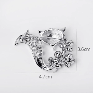 Silver flower brooch back view with pin fastener measuring 4.7cm by 3.6cm