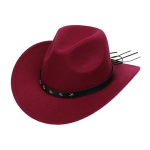 Detail of burgundy felt cowboy hat featuring a black leather band and silver star studs
