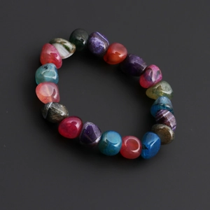 Detailed view of irregular cracked colorful agate beads with natural ice textures