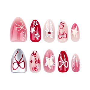 Bow and star almond press-on nails with red gradient and pearl details on white background