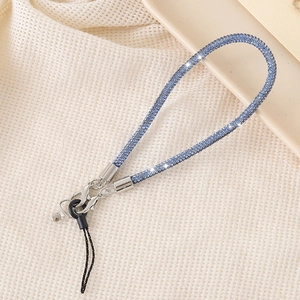 Close-up of sparkling blue rhinestone wrist strap with silver metal lobster clasp and ring