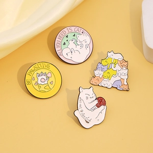 Set of four cute cartoon cat enamel pins featuring paw prints and humorous cat quotes