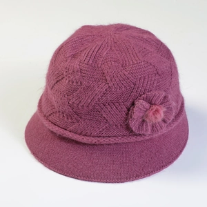 Close-up of dark purple knitted bucket hat with thick thermal fleece and floral decor