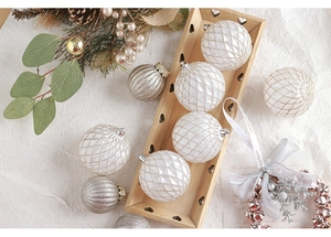 Detailed view of white diamond pattern and silver striped glitter Christmas ball ornaments
