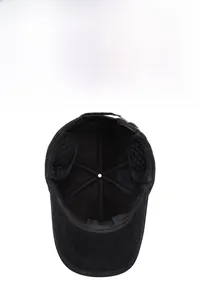 Detail of winter baseball cap's inner quilted lining and foldable ear protection flap