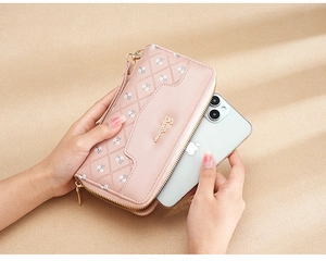 Pink quilted floral wallet showing large capacity by fitting a smartphone inside