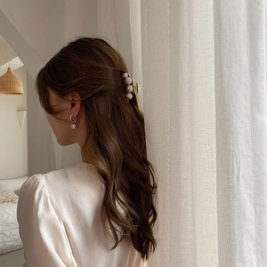 Elegant pearl hair claw clip and matching earrings set with gold metal finish