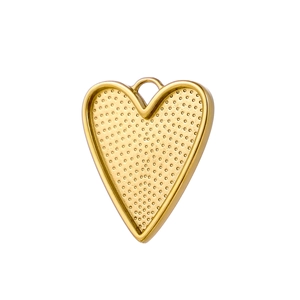 Macro detail of golden heart-shaped metal pendant with textured surface for DIY jewelry