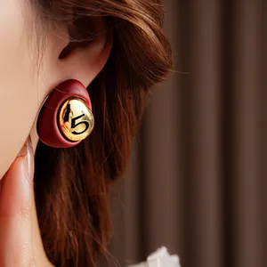 Elegant gold-plated red droplet earrings featuring a vintage numeral 5 design for women