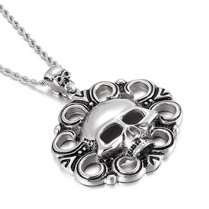 Vintage silver skull pendant necklace for men with intricate hollowed patterns and twist chain