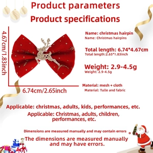 Detailed view of red tulle Christmas bow hair clip with golden reindeer design