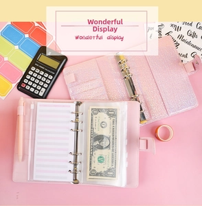 Close-up of A6 pink glitter PU leather budget binder with zip pockets and pen