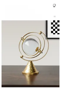 Detail of Nordic luxury iron art ornament with gold hammered base and crystal sphere