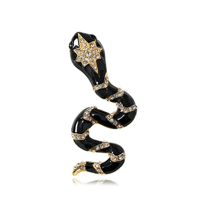 Detailed view of snake brooch featuring black enamel and star-shaped crystal cluster