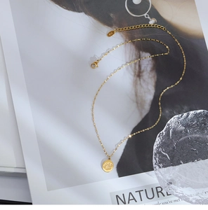 Detailed macro view of gold cat paw pendant necklace with extension chain and clasp