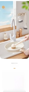 Detail of ecoco dish brush with liquid dispenser and wall-mounted storage rack