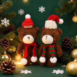Christmas teddy bears in red knit hats and scarves on a festive background