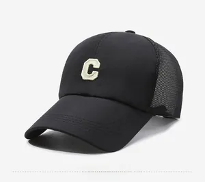 Side view of black mesh baseball cap with yellow C letter embroidery and breathable mesh