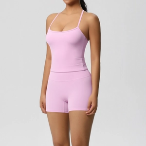 Detail of pink brushed high-stretch yoga set with cross-back tank and cycling shorts