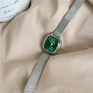 Vintage women's square silver watch with emerald green dial and faceted glass lens