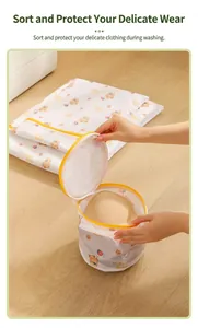 Detail showing hand placing a bra into the cartoon bear printed mesh laundry bag