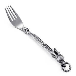 Punk style stainless steel dinner fork featuring a vintage silver dragon handle carving
