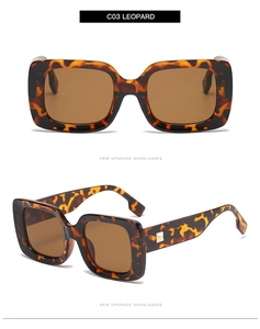 Detail view of square leopard print sunglasses with golden metal rivet accents