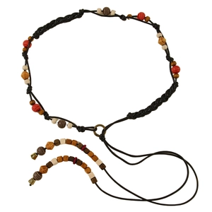 Detail of bohemian braided waist chain with multi-colored beads and metal ring connector